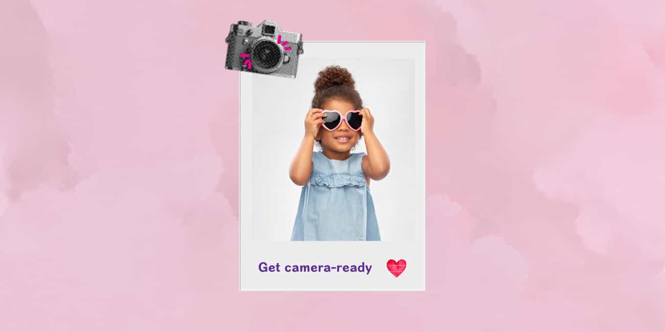 young girl wearing sunglasses and smiling for a picture