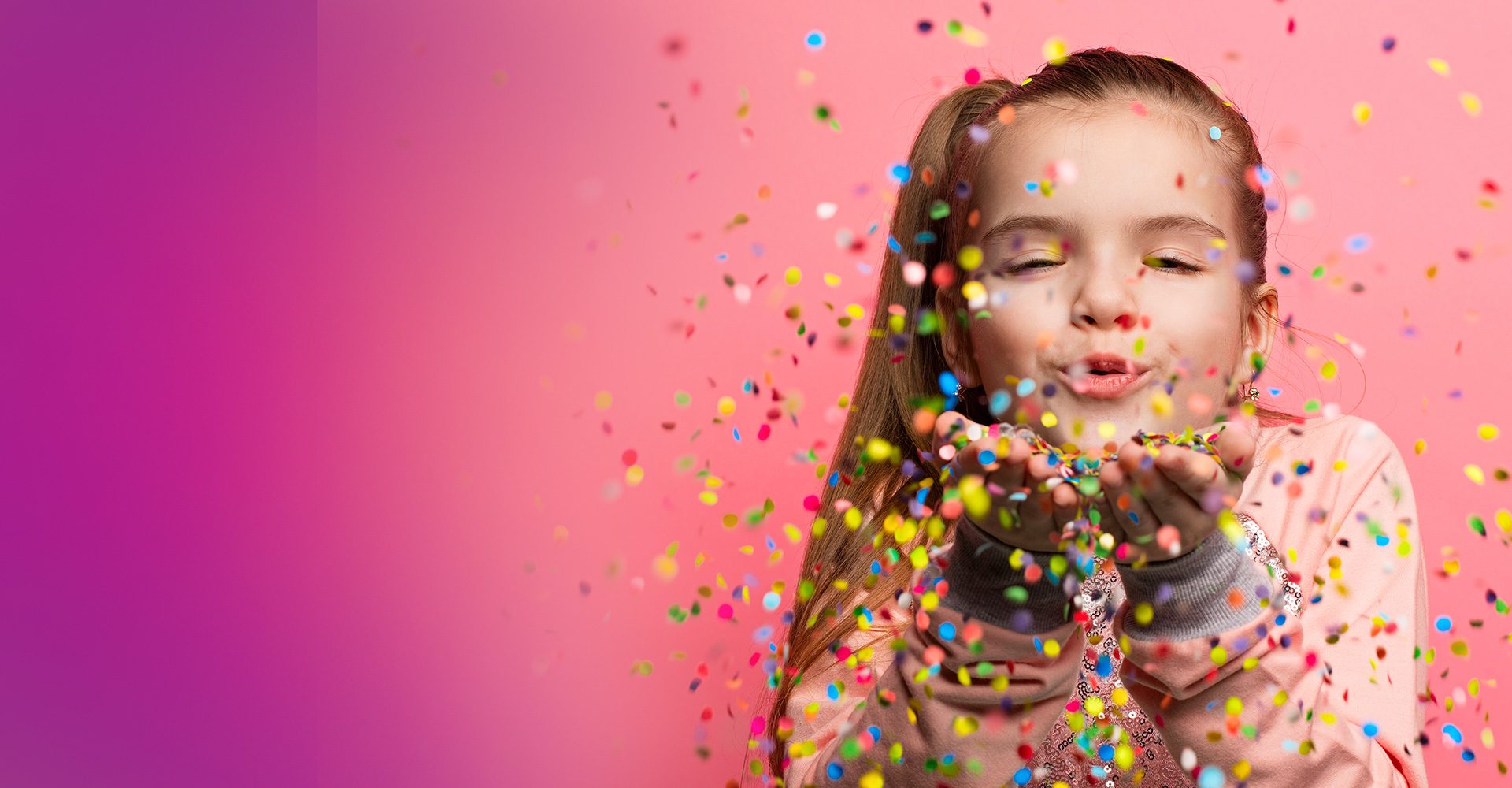 Girl blowing glitter in the air