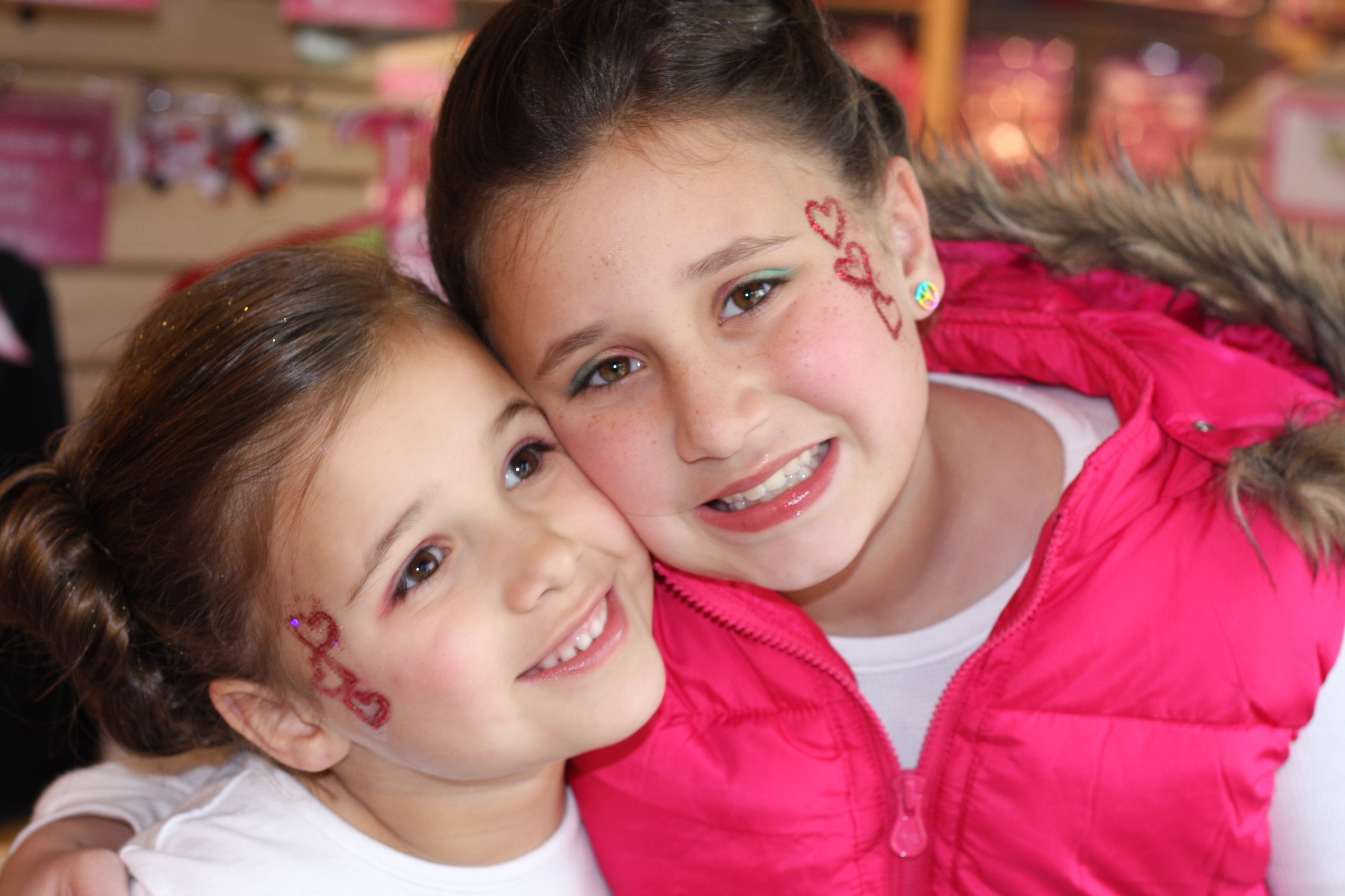 Two young friends smiling for photo at one of Sweet & Sassy kids events
