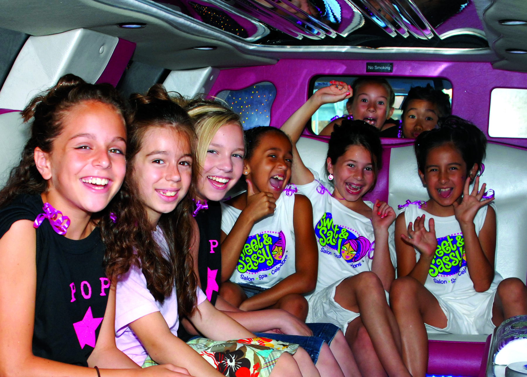 Girls sitting together in a limo